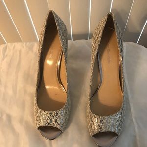 Woman’s silver stilettos with peek a boo toe